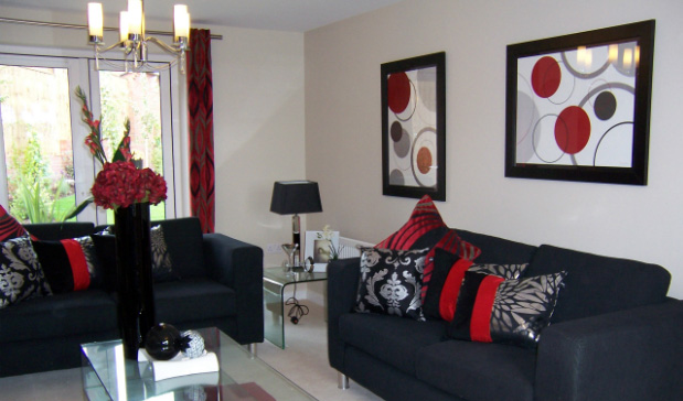 Photo of a modern, nicely decorated lounge room with framed prints on the wall